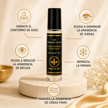Cargar imagen en el visor de la galería, Gel para ojeras con miel y ácido hialurónico en envase con beneficios para el contorno de ojos.
